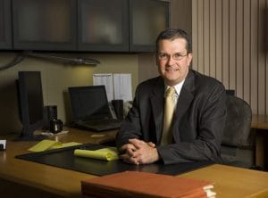 Photo of Tim Richard at a desk